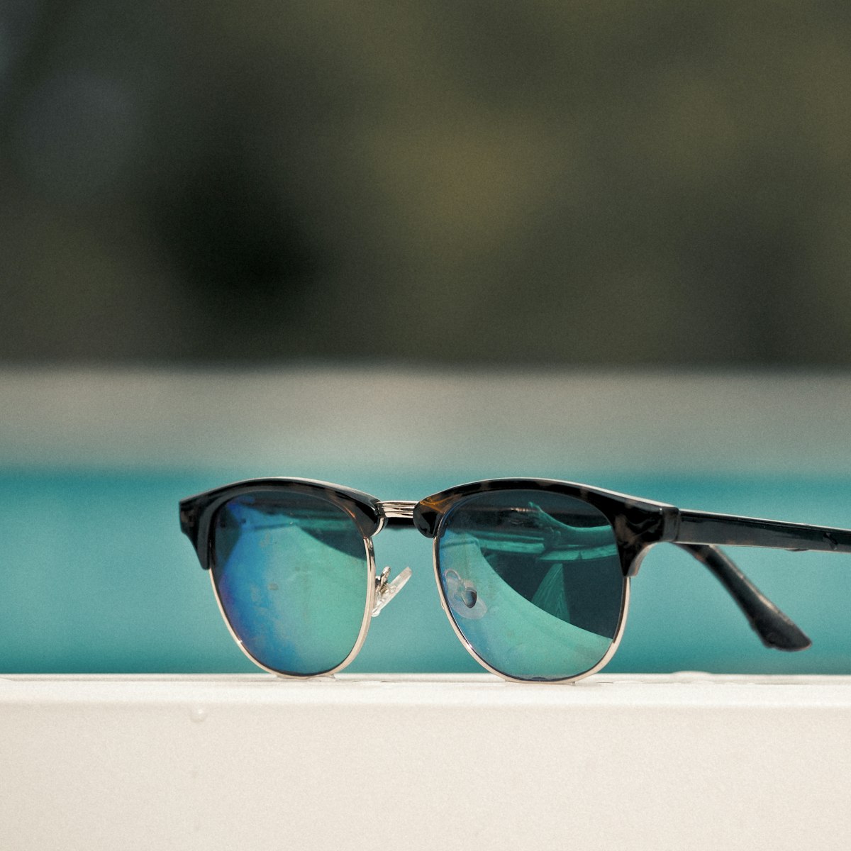 Eclipse sunglasses by the pool