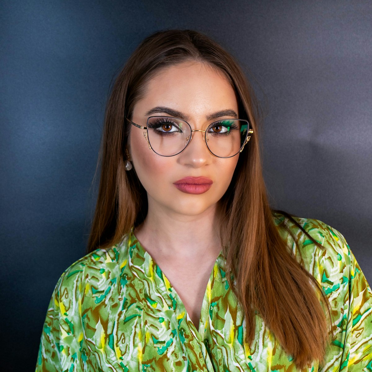 Woman wearing cat-eye eyeglasses