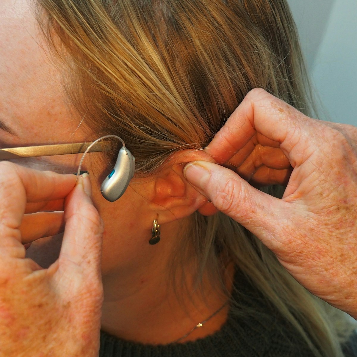 Hearing aid being fitted