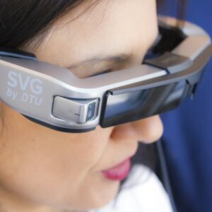 Woman wearing smart display glasses